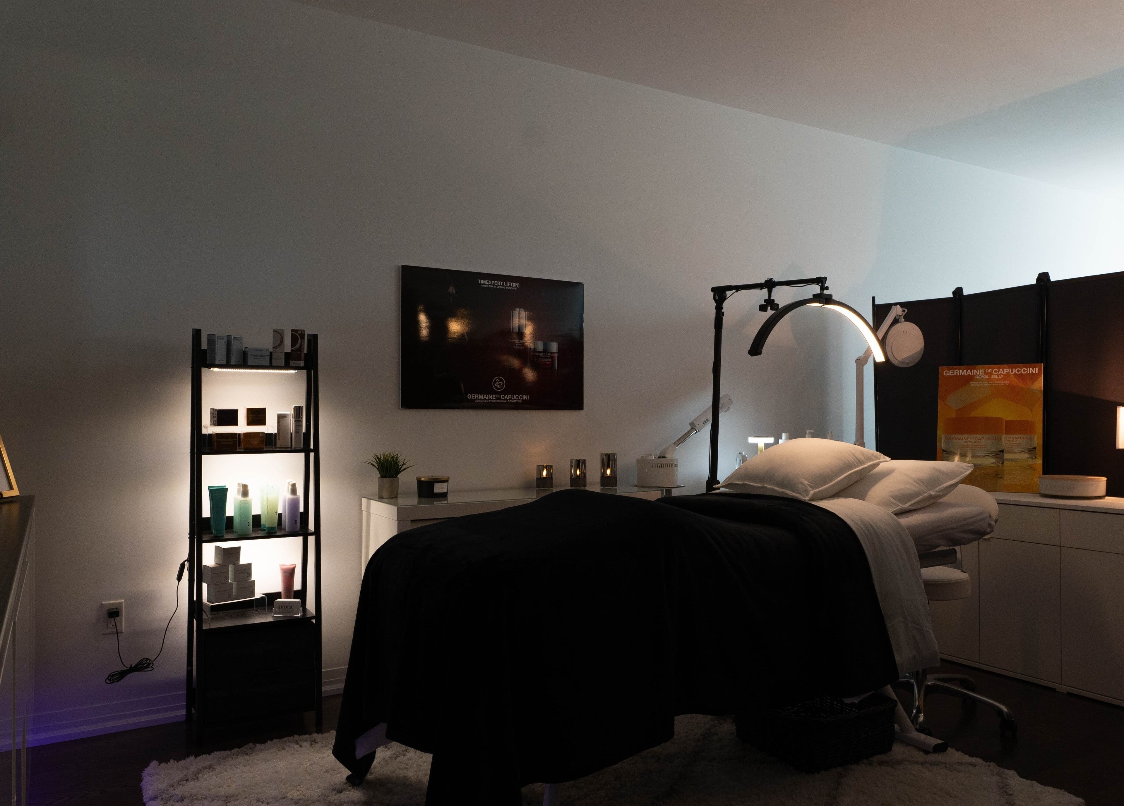 Tranquil spa treatment room at Diora Med Spa, Milton, Ontario, CA with modern decor and cozy ambiance.