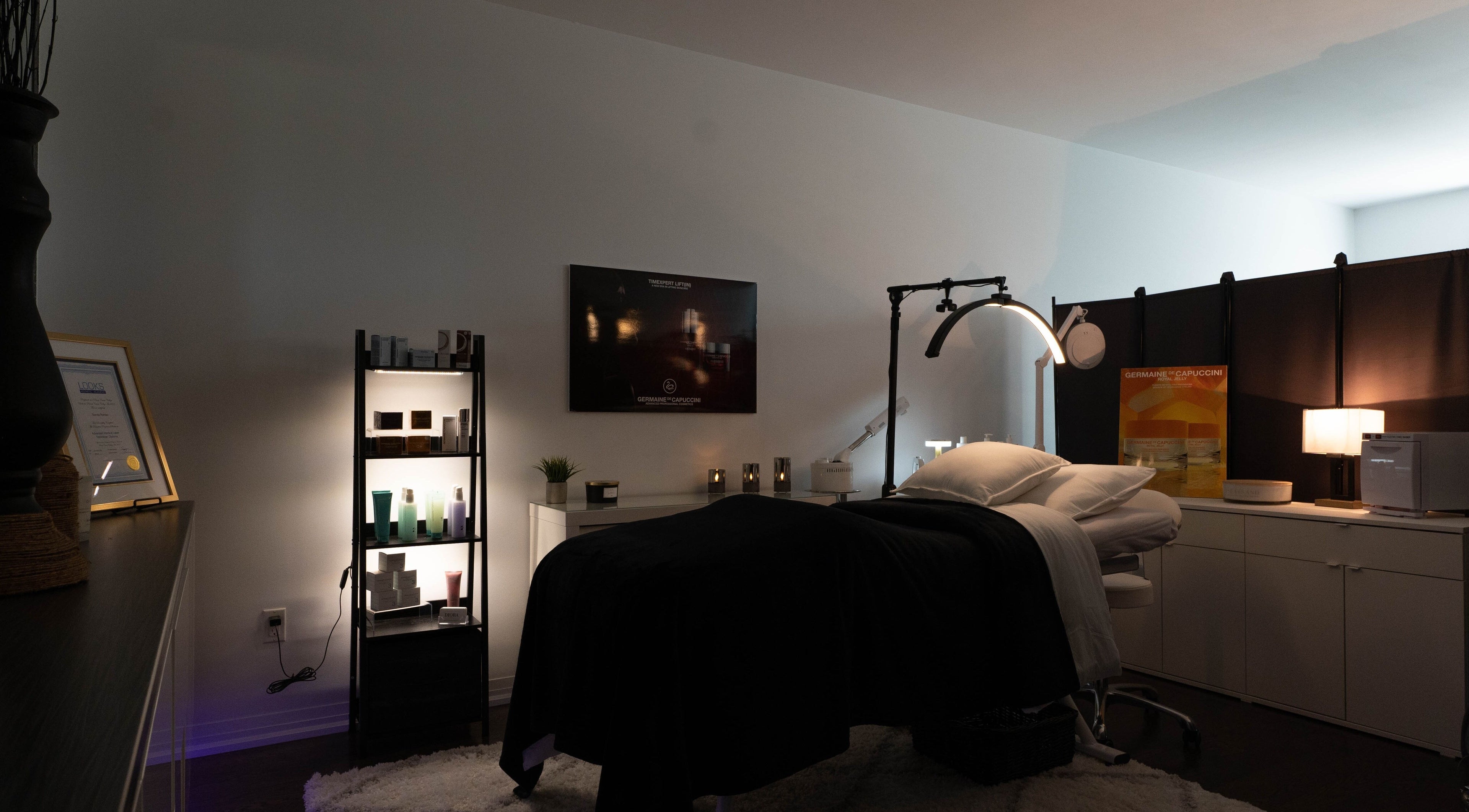 Tranquil spa treatment room at Diora Med Spa, Milton, Ontario, CA with modern decor and cozy ambiance.