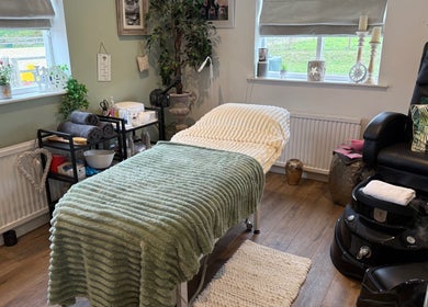 Cozy treatment room at Annabel's Beauty in Stowmarket, England, GB, featuring a plush table and relaxing decor.