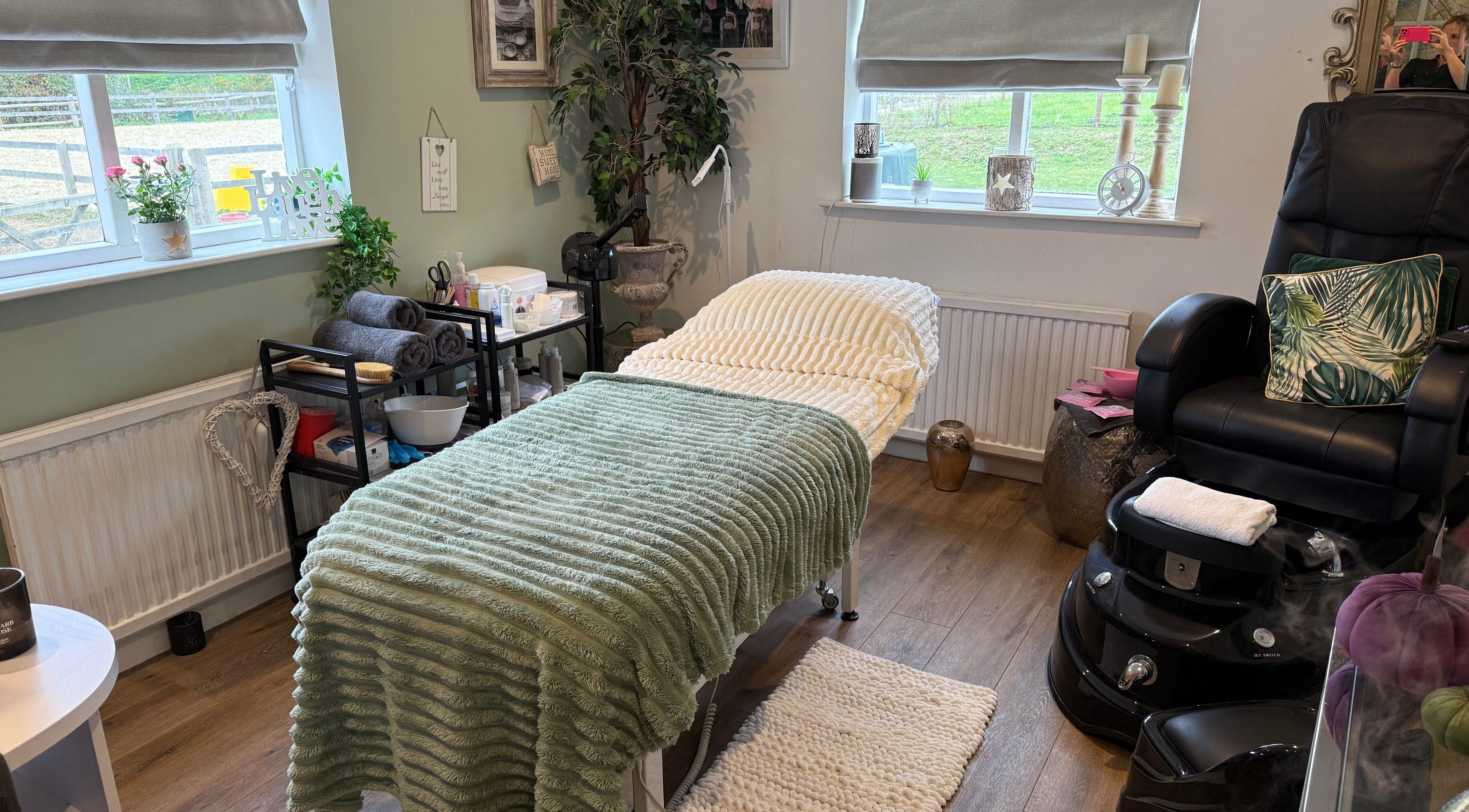 Cozy treatment room at Annabel's Beauty in Stowmarket, England, GB, featuring a plush table and relaxing decor.