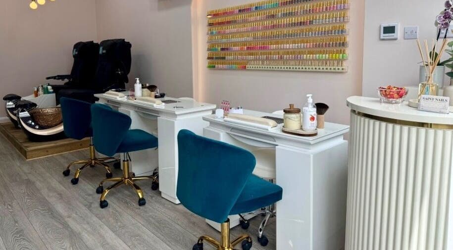 Relaxing nail salon interior at Saint Nails Caterham, Caterham, England, GB with stylish decor and manicure stations.