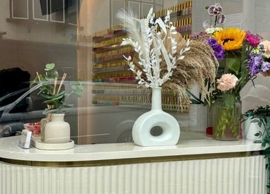 Stylish floral decor at Saint Nails Caterham, Caterham, England, GB enhancing the welcoming entrance.
