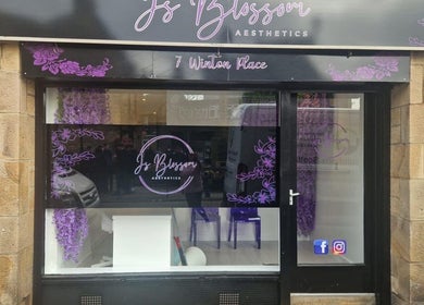 Front view of Skin By Shannon, Tranent, Scotland, GB showcasing elegant floral designs and inviting entrance.