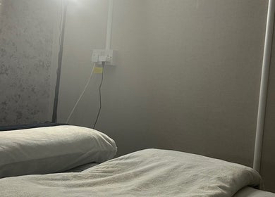 A tranquil treatment room at Beauty By Aimee, Omagh, Northern Ireland, GB, showcasing a plush massage bed.