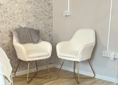 Welcoming seating area at Beauty By Aimee, Omagh, Northern Ireland, GB, featuring plush chairs.