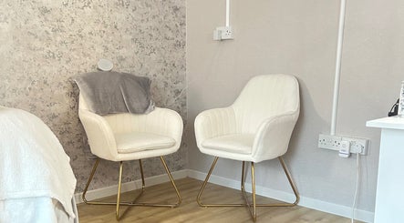 Welcoming seating area at Beauty By Aimee, Omagh, Northern Ireland, GB, featuring plush chairs.