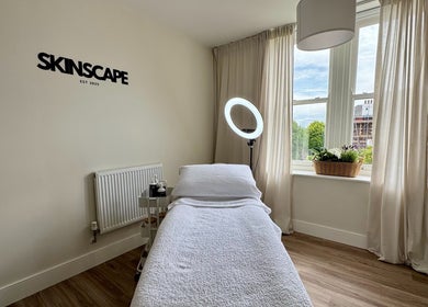 Relaxing treatment room at Skinscape Bristol, featuring a comfortable bed and ambient lighting in Bristol, England, GB.