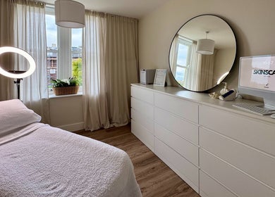 Bright treatment room at Skinscape Bristol featuring cozy bed and sleek decor in Bristol, England, GB.