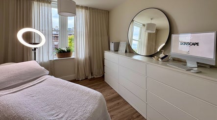 Bright treatment room at Skinscape Bristol featuring cozy bed and sleek decor in Bristol, England, GB.