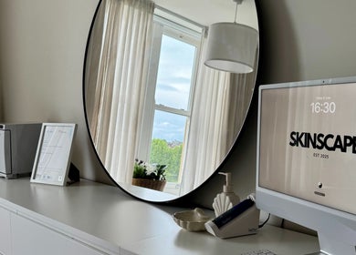 Modern decor at Skinscape Bristol featuring a sleek desk and mirror in Bristol, England, GB.