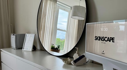 Modern decor at Skinscape Bristol featuring a sleek desk and mirror in Bristol, England, GB.