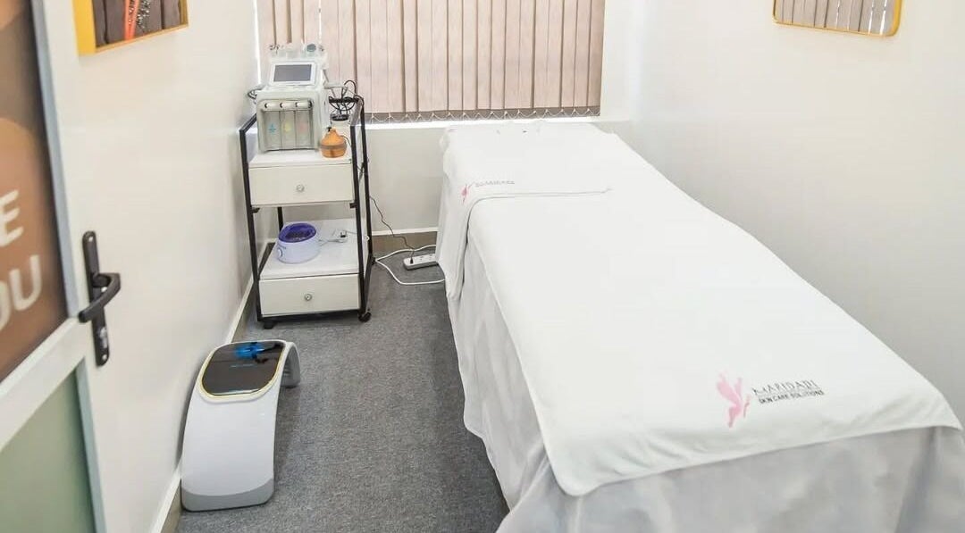 Relaxing treatment room at Maridadi Skincare Solutions, Nairobi, Nairobi County, KE, with a comfortable bed.