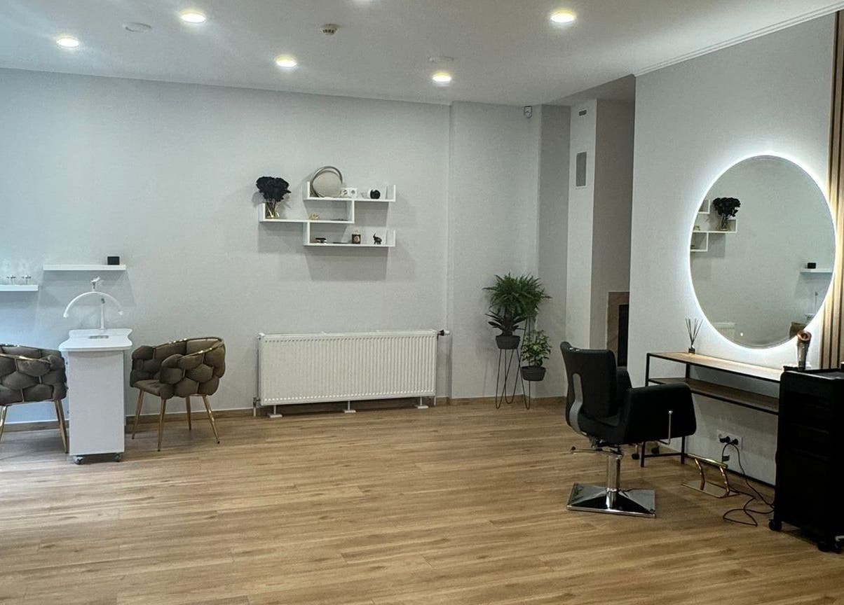 Modern salon interior at Hair By Sandra, Rīga, LV, featuring stylish decor and seating.