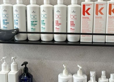 Hair care products on display at Hair By Sandra, Rīga, LV, showcasing premium salon quality.