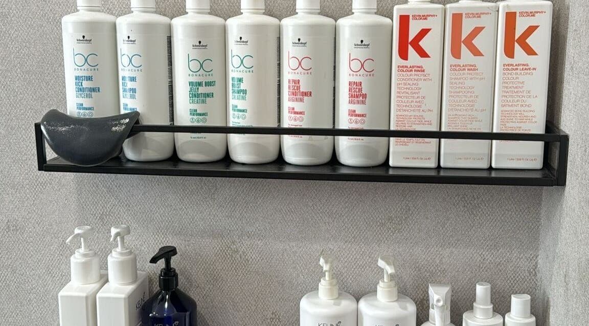 Hair care products on display at Hair By Sandra, Rīga, LV, showcasing premium salon quality.