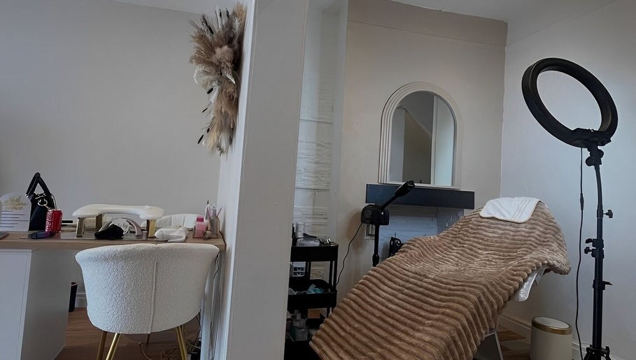 Cozy treatment room at The Skin Refinery Clinic, Worsley, England, GB, featuring a plush bed and stylish decor.
