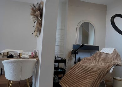 Cozy treatment room at The Skin Refinery Clinic, Worsley, England, GB, featuring a plush bed and stylish decor.