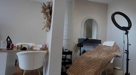Cozy treatment room at The Skin Refinery Clinic, Worsley, England, GB, featuring a plush bed and stylish decor.
