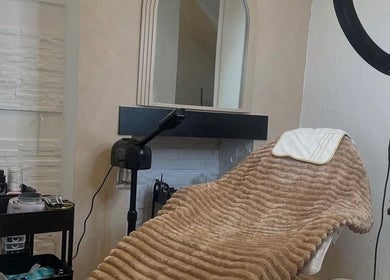 Cozy treatment room at The Skin Refinery Clinic, Worsley, England, GB with a plush blanket and ring light.