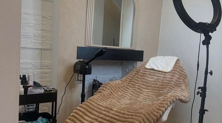 Cozy treatment room at The Skin Refinery Clinic, Worsley, England, GB with a plush blanket and ring light.
