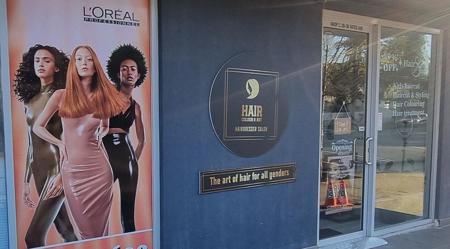 Entrance of Hair Colour & Art, Dundas Valley, featuring modern styling and L'Oreal poster.