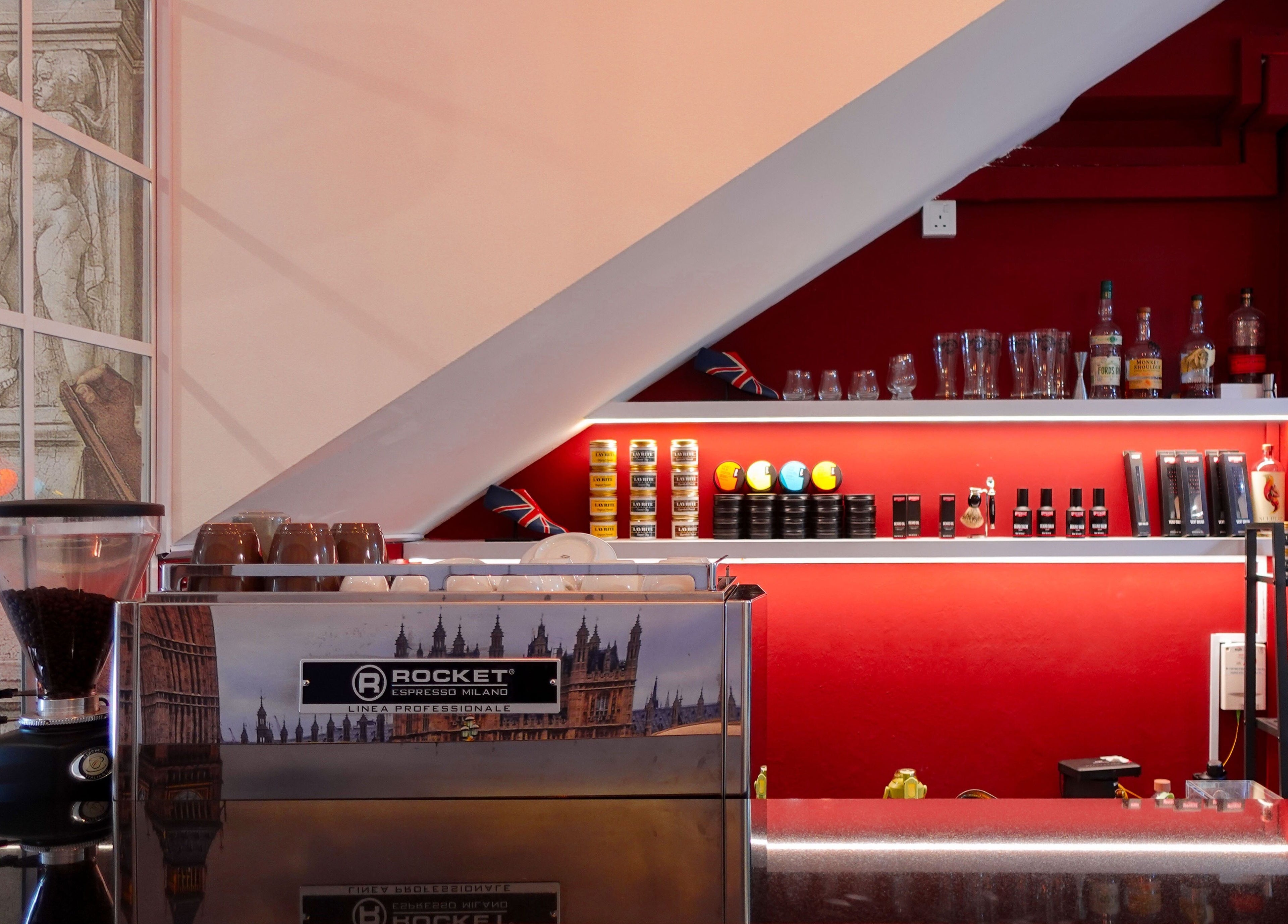 Elegant coffee setup at Jermyn Street, Singapore, Singapore, SG with rich red tones and luxury products.