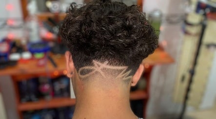 Creative hair design at Gianluca_cutz, Ħaż-żabbar, MT showcasing intricate fade pattern.