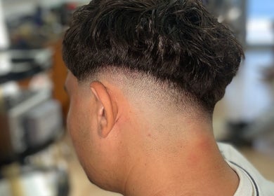 Close-up of a stylish fade haircut by Gianluca_cutz in Ħaż-żabbar, MT salon.