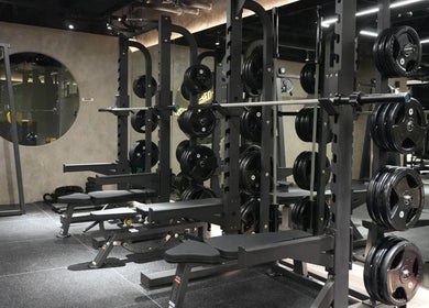 Flex Gym Bgc in Taguig City features advanced weightlifting equipment for ultimate fitness training.