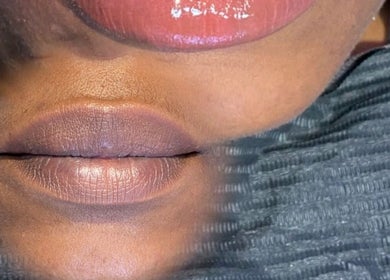 Close-up of glossy lips reflected in a mirror at LabtoLips, Halstead, England, GB.