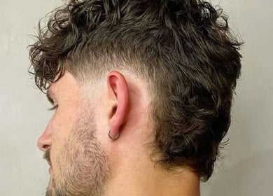 Stylish curly men's haircut at Mens Haircut Windsor by Ritzy’s, Windsor, England, GB.