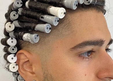 Perm rods in men's hair at Mens Haircut Windsor by Ritzy’s, Windsor, England, GB.