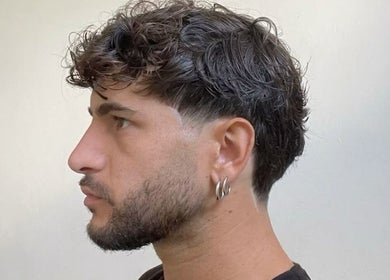 Trendy men's haircut with waves at Mens Haircut Windsor by Ritzy’s, Windsor, England, GB.