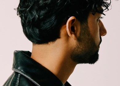 Modern men's haircut by Ritzy’s in Windsor, England, GB showcasing stylish groomed look.