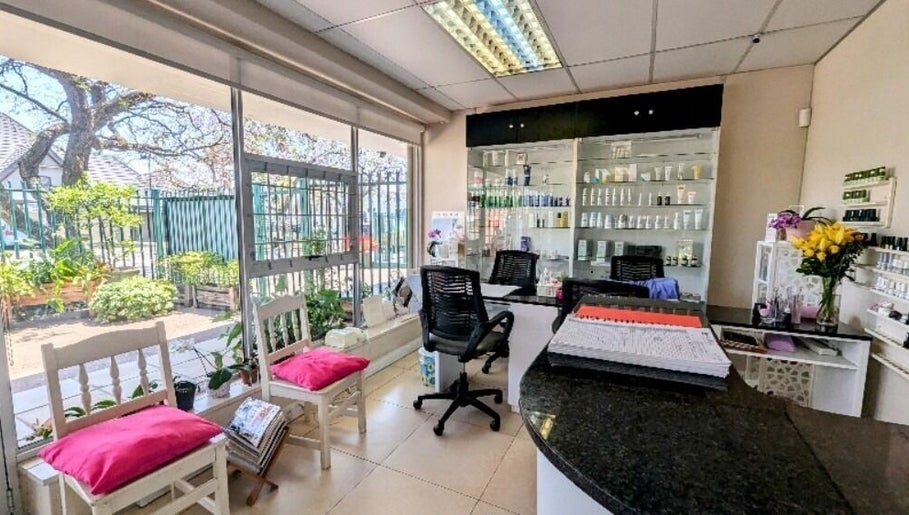 Bright and welcoming reception area at Pepa Health & Beauty, Pretoria, Gauteng, ZA with cozy chairs and product display.
