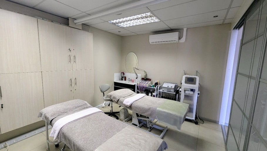 Relaxing treatment room at Gelah Health & Beauty, Pretoria, Gauteng, ZA with modern equipment and plush beds.