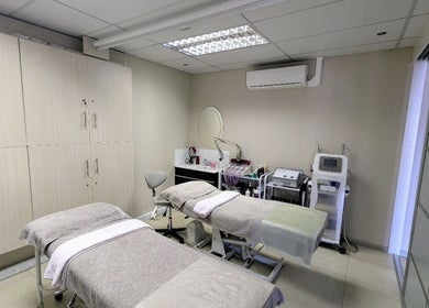 Relaxing treatment room at Gelah Health & Beauty, Pretoria, Gauteng, ZA with modern equipment and plush beds.