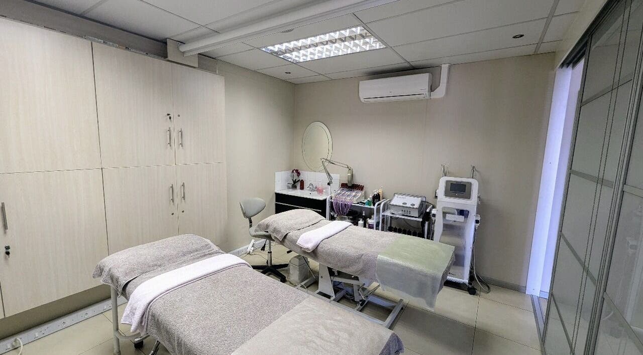 Calm treatment room at Gelah Health & Beauty, Pretoria, Gauteng, ZA, featuring two massage tables.