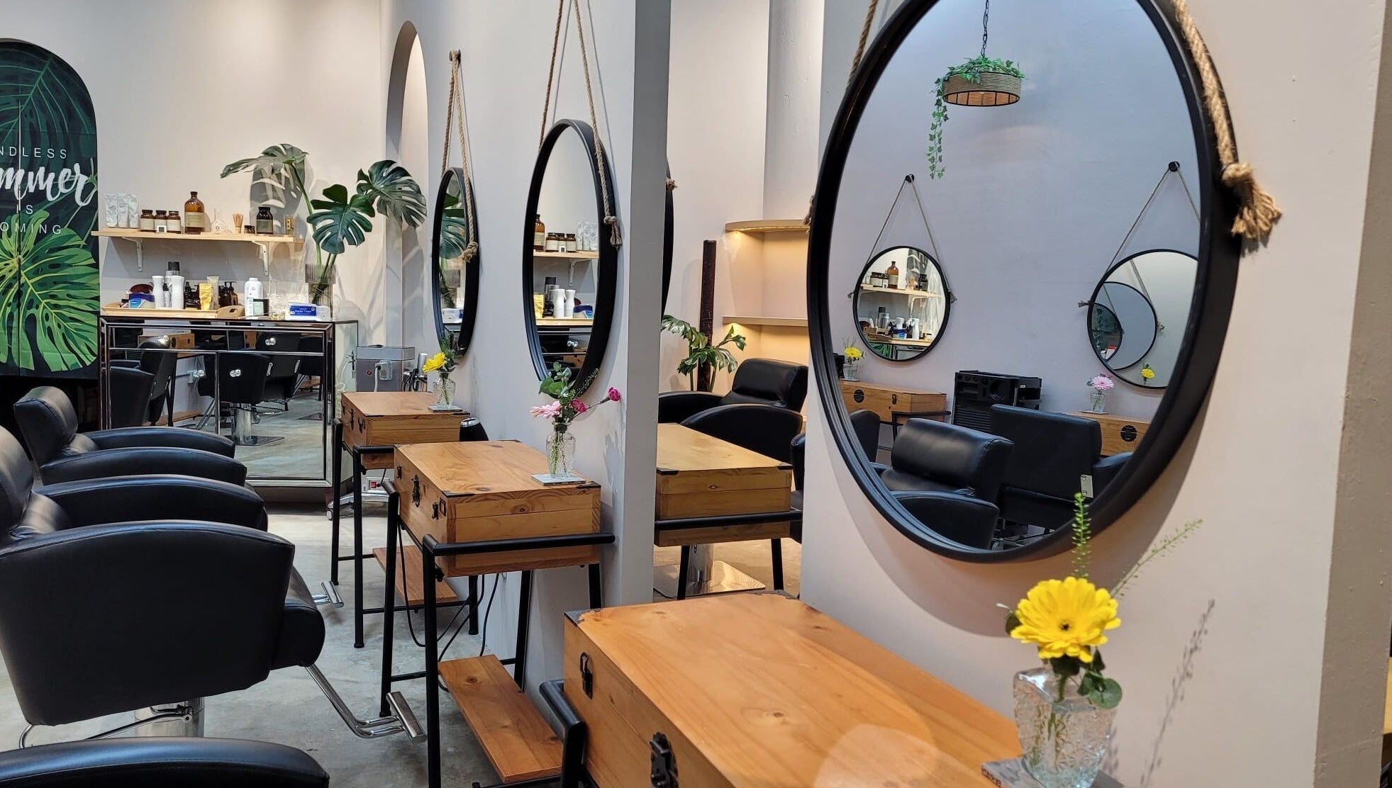 Modern styling chairs and mirrors at Colour Haven Hair Studio, Singapore, Singapore, SG reflect a chic ambiance.