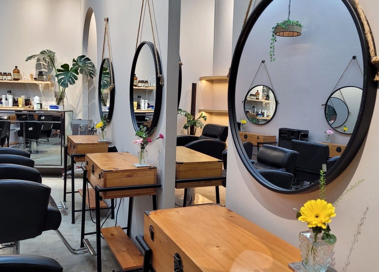 Modern styling chairs and mirrors at Colour Haven Hair Studio, Singapore, Singapore, SG reflect a chic ambiance.