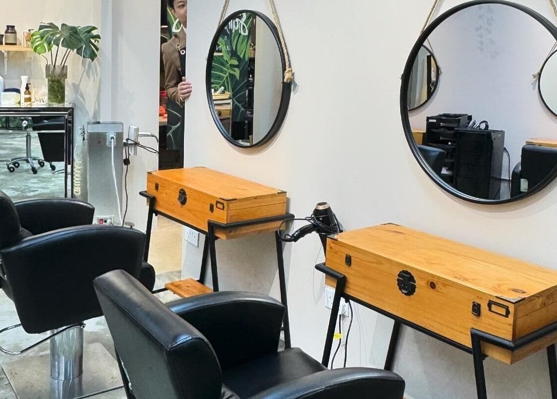 Modern salon interior at Colour Haven Hair Studio, Singapore, Singapore, SG with stylish mirrors and seating.