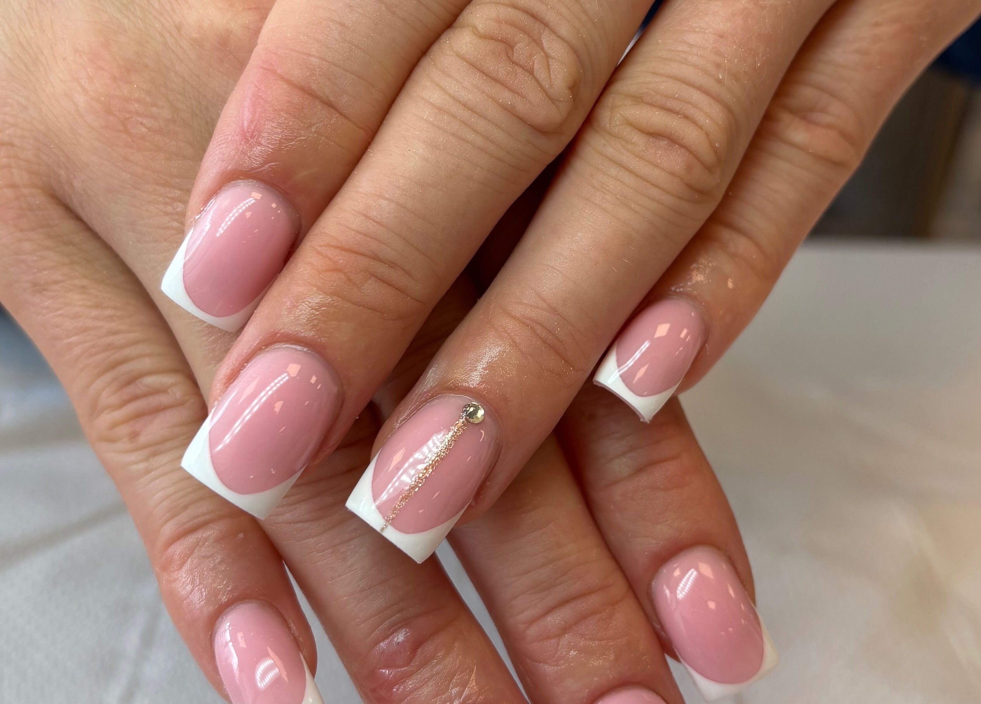 Elegant French manicure featuring pink and white tips at Glam By Jas, Limerick, County Limerick, IE.