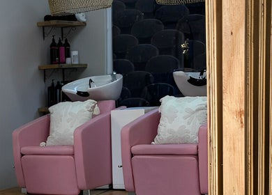 Stylish pink salon chairs at Missmay Did My Hair, Ballito, Kwazulu-natal, ZA, offering a chic and cozy setting.