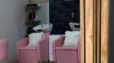 Stylish pink salon chairs at Missmay Did My Hair, Ballito, Kwazulu-natal, ZA, offering a chic and cozy setting.