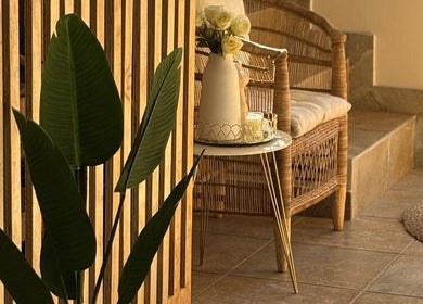 Cozy rattan seating at Missmay Did My Hair, Ballito, Kwazulu-Natal, ZA, with elegant plant decor.