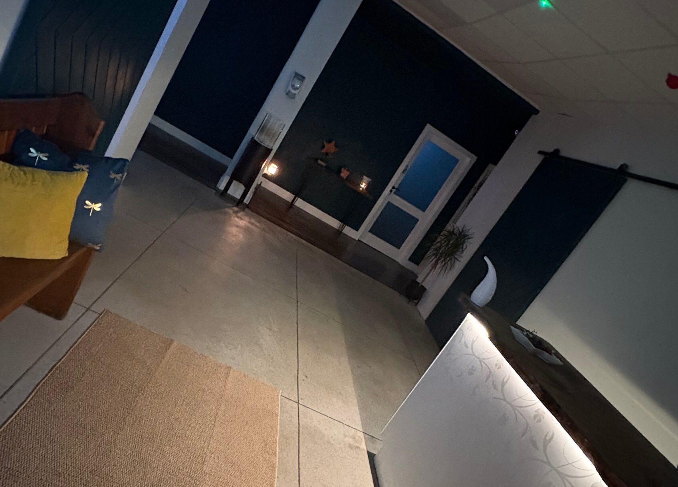 Inviting reception area at Enhance With Claire in Dunfermline, Scotland, GB with warm lighting and seating.