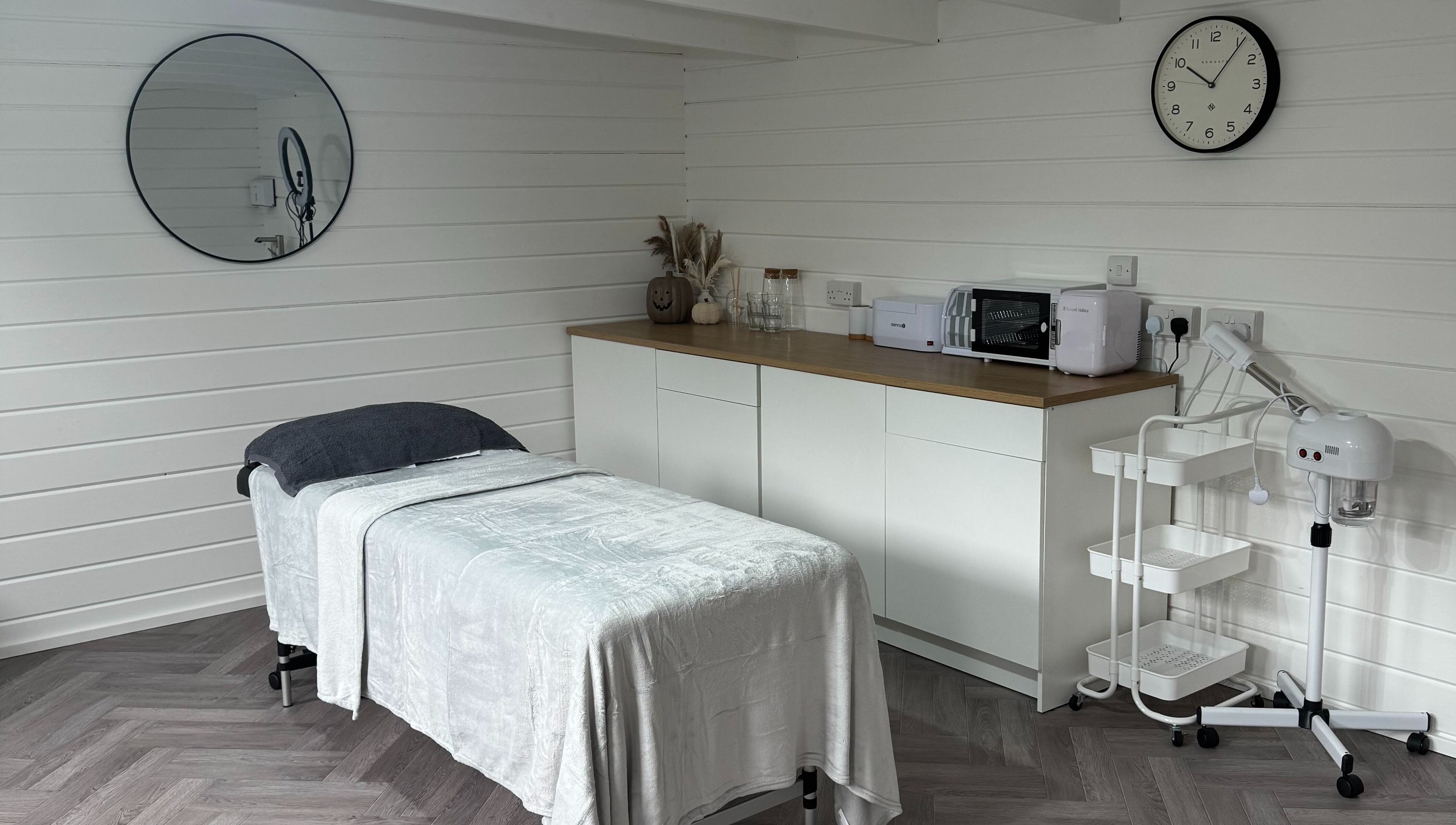 Tranquil treatment room at Silken Beauty by Sophie, Littleport, England, GB with modern decor and massage bed.