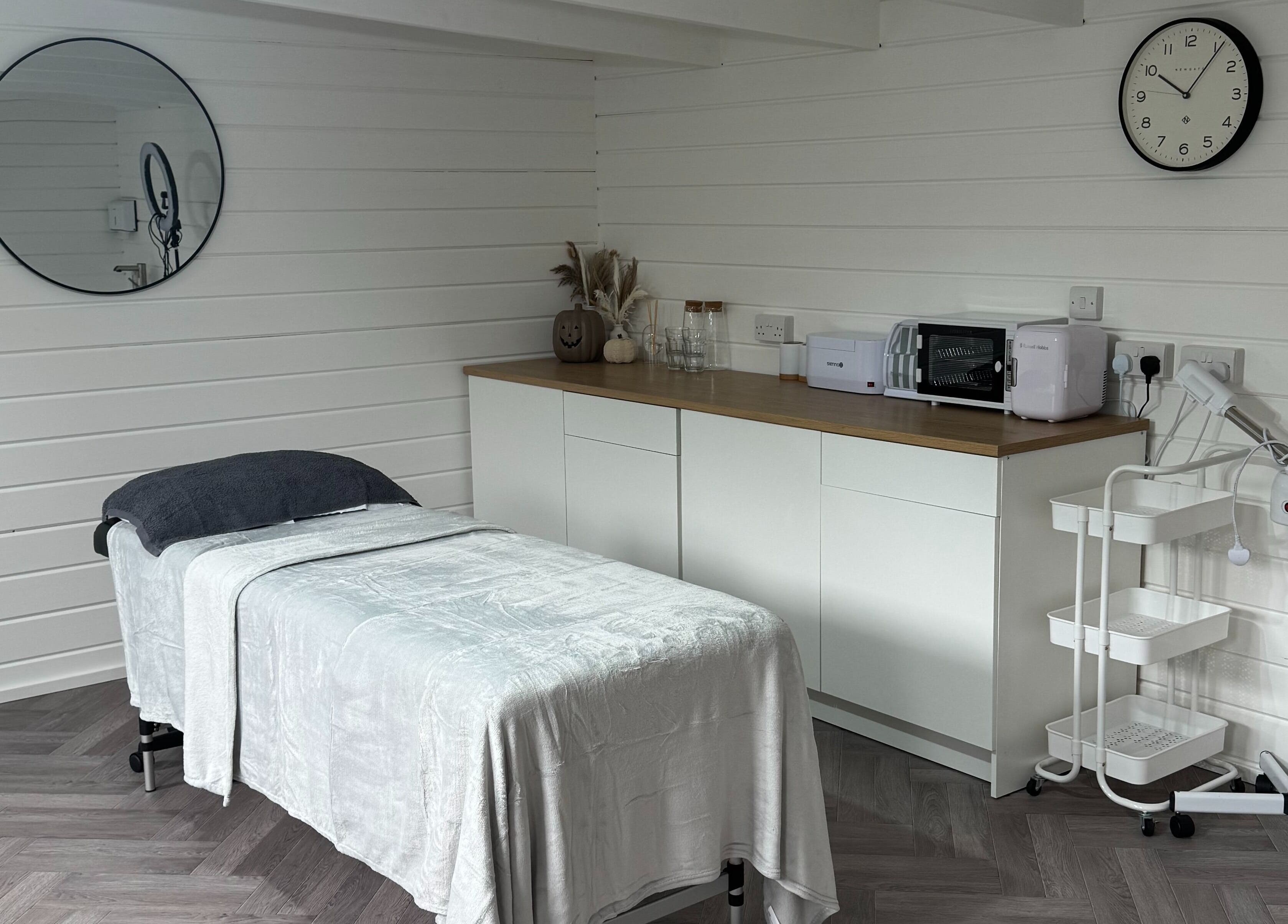 Tranquil treatment room at Silken Beauty by Sophie, Littleport, England, GB with modern decor and massage bed.