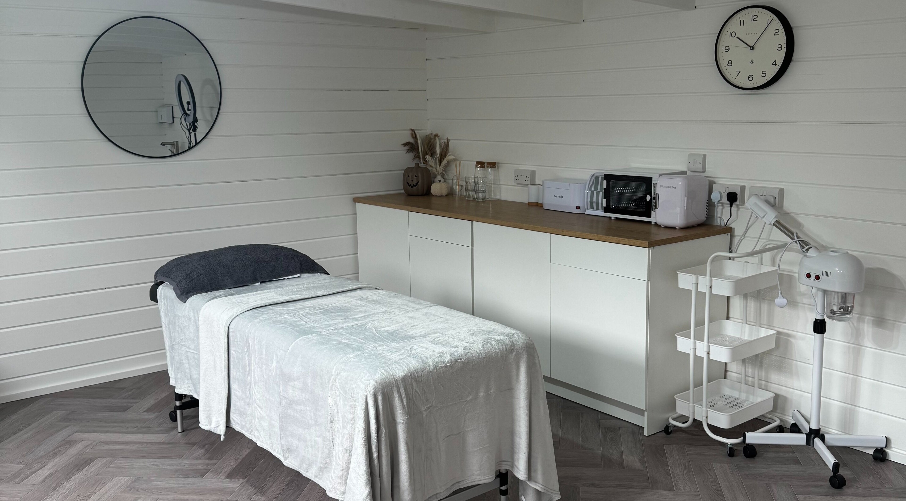 Tranquil treatment room at Silken Beauty by Sophie, Littleport, England, GB with modern decor and massage bed.