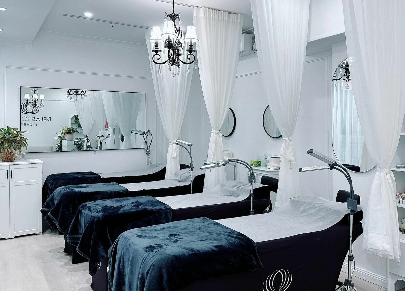 Chic beauty treatment room at DE LASH DOUBLE BAY, Double Bay, New South Wales, AU with cozy lash beds and elegant decor.
